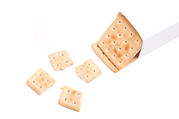 a packet of biscuits and one broken isolated on white background