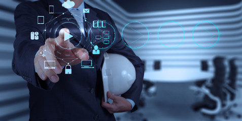 Businessman hand press play button sign to start or initiate pro