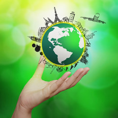 hand showing airplane traveling around the world on green nature