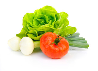 Fresh tomatoes and green salad with onion isolated on white back