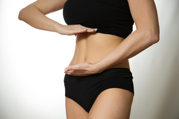 Fototapeta premium Hand on the tummy