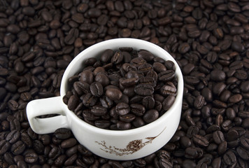 Coffee beans in cup