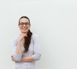 Young woman with glasses smiling