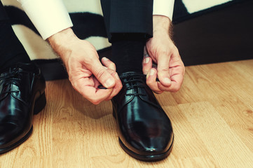 Business man dressing up with classic, elegant shoes