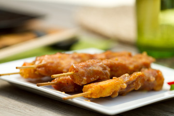 Satay chicken on skewers al fresco