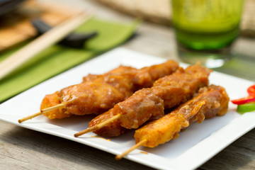 Satay chicken on skewers al fresco