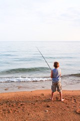 young boy fishing 