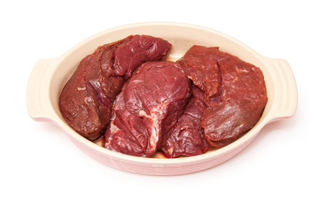 Kangaroo steaks isolated on a white background.