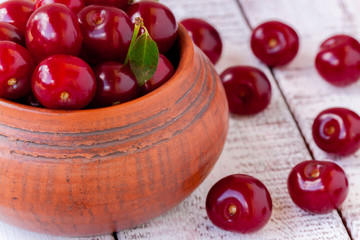 juicy ripe cherry on a white wooden background