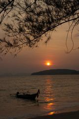 Long tail boat as sun set at Ao Nang