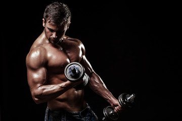 athletic young man on black background