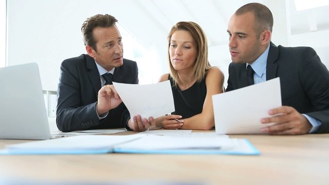 Business people meeting around table in office