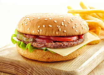 burger on wooden cutting board