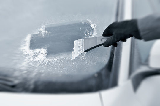 Winter driving - Scraping ice from a windshield