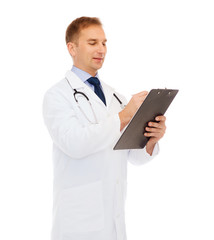 smiling male doctor with clipboard and stethoscope