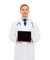 smiling male doctor with tablet pc
