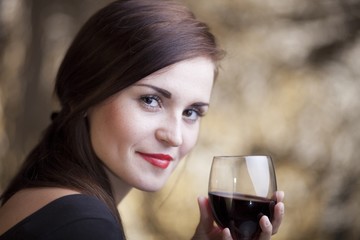 Elegant glamour woman with glass of red wine