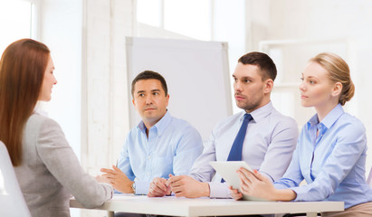 business team interviewing applicant in office