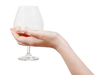 glass with brandy in hand isolated