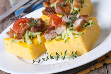 Corn porridge with meat, vegetables and thyme