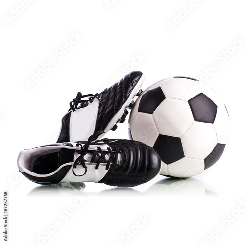 soccer shoes and ball