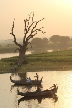 Sunset on the boat, view from U Bein Bridge