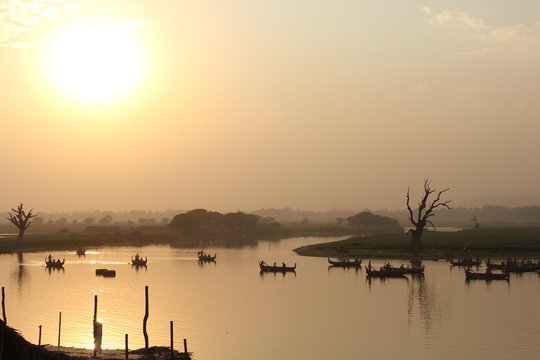 Sunset on the boat, view from U Bein Bridge