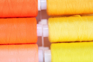 Multicolor sewing threads background