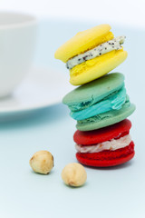 Sweet and colorful French macaroons on pastel background