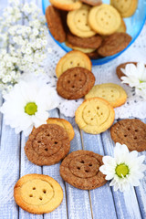 Sugar cookies in shape of buttons on table
