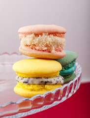 Sweet and colorful French macaroons on pastel background