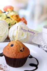 Blueberry muffin with chocolate sauce