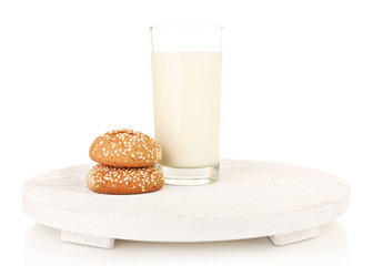 Milk and cookies on wooden tray isolated on white