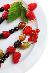 Fresh fruit kebabs for healthy snack on plate close up
