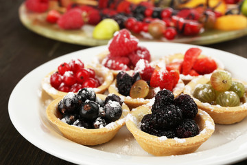 Fresh berries dessert for healthy snack on wooden table close
