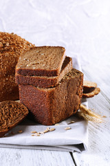 Fresh bread on wooden table, close up