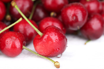 Ripe sweet cherries on wooden table