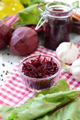 Grated beetroots in bowl on table close-up