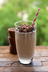 Milk cocktail in glass and chocolate cookies