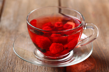 Fruit red tea with wild berries in glass cup,