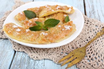 Sweetened fried banana on plate, close-up