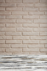 Empty wooden table on wall background