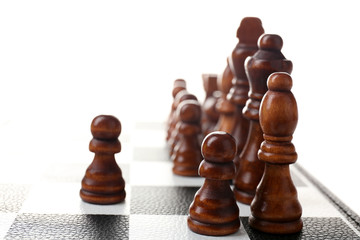 Chess board with chess pieces isolated on white