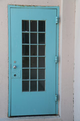 rustic blue door with silver doorknob