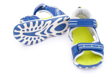 pair of blue sandals for kid on white background