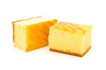 two pieces of sponge cakes on a white background