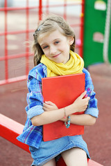 Beauty fashion brunette school age kid girl with notepad