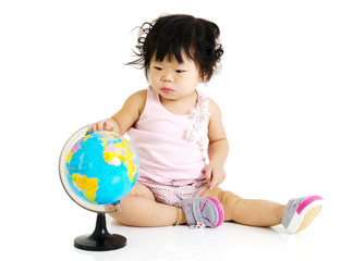 Little baby pointing to globe
