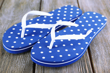Color flip-flops on wooden background