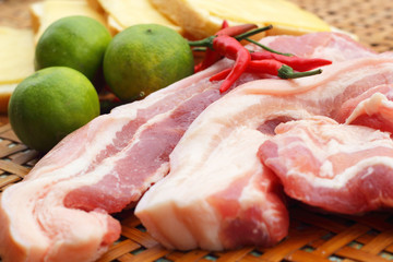 Streaky pork in the basket - for cooking.